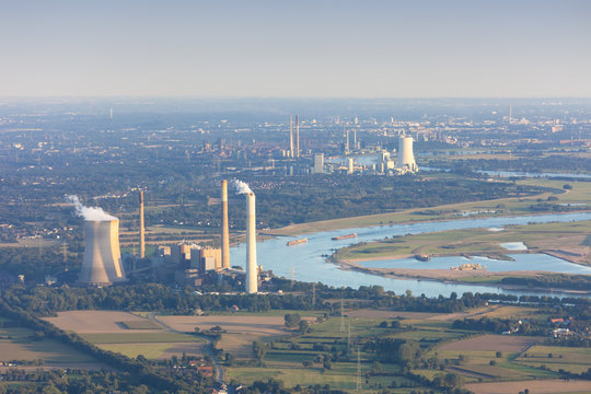 Rhine River bend Orsoy with agricultural, industrial and residential districts in the Lower Rhine Region of Germany