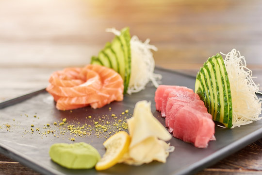 Sashimi set including salmon and tuna. Raw salmon and tuna sashimi set, japanese food style. Restaurant of japanese cuisine.