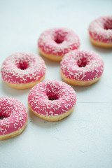 Donut. Sweet icing sugar food. Dessert colorful snack. Glazed sprinkles. Treat from delicious pastry breakfast. Bakery cake. Doughnut with frosting. Baked unhealthy round. Top view