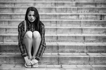 Girl in a clown makeup black and white