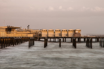 Fototapeta premium Pier at sunset with a sea so soft