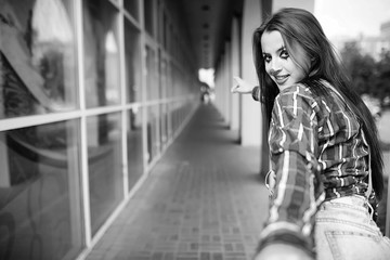 Girl in a clown makeup black and white