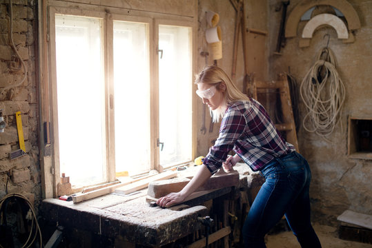 Woman doing a carpenter work