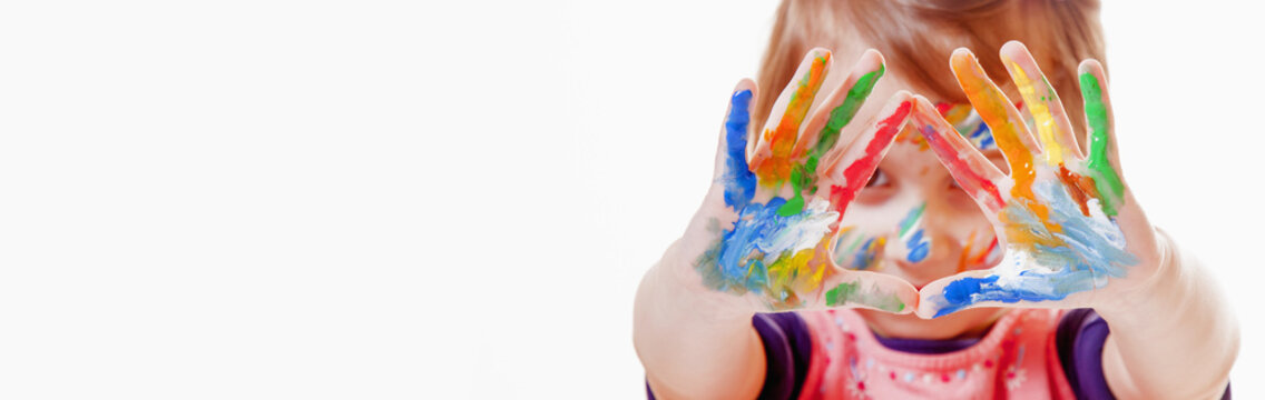 Beautiful little child girl with colorful painted hands.