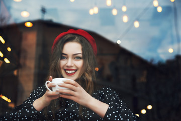 Young beautiful fashionable happy smiling girl with red lips, wearing french style beret and polka...