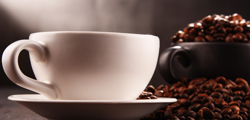 Composition with two cups of coffee and beans