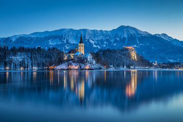 Twilight view of Lake Bled with Bled Island and Bled Castle in winter, Slovenia