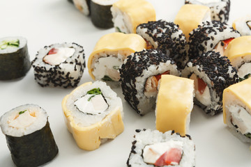 Closeup set of sushi rolls on white background