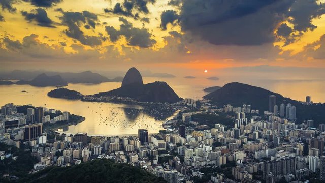 Sunrise over Sugarloaf Mountain in Rio de Janeiro, Brazil. High angle view with reflection of the rising sun on water