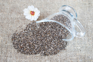 Spilled chia seeds on a linen tablecloth