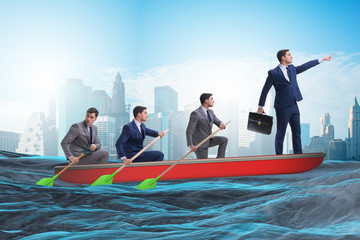 Team of businessmen in teamwork concept with boat © Elnur