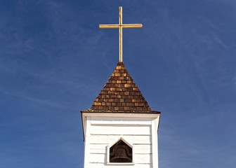 Isolated Church Tower and Cross against Blue Sky Background in Lost Dutchman State Park east of Apache Junction in Arizona