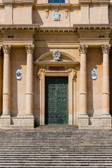 Obraz premium Detail of the entrance door of the Cathedral of San Nicola di Mira in the center of Noto, in Sicily. In 2002 it was declared a UNESCO World Heritage Site