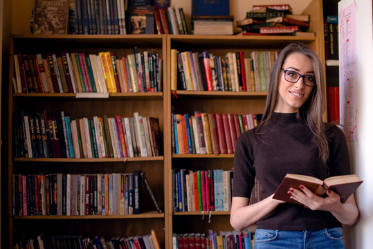 Cheerful woman in library