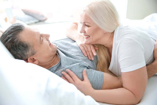 Senior Couple In Bed Together At Home