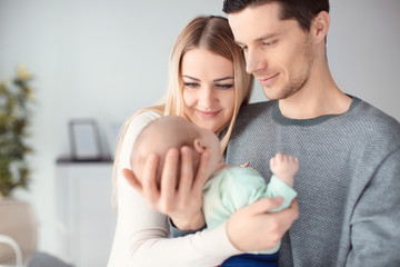 Young parents with baby at home