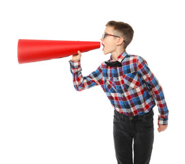 Funny little boy with paper megaphone on white background