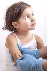 Nurse vaccinating 3 years old little girl