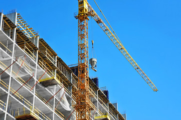Crane and highrise construction site