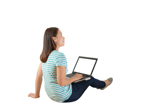 Young creative woman sitting in the floor with laptop