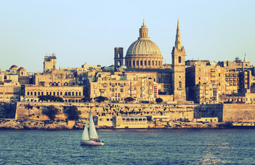 Valletta, Malta cityscape background with sailboat