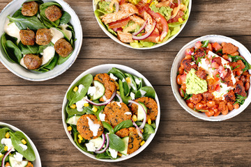 various salad bowls meatballs green mains starter diet light dish from above table few many choice healthy organic