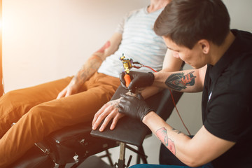 Tattoo artist creating a tattoo on a man's arm. concept art