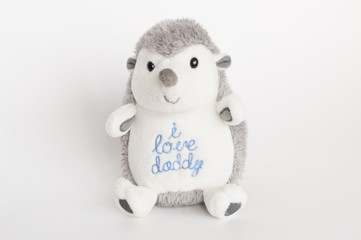 baby toy - little gray hedgehog on a white background