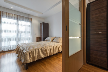 Interior of a luxury loft bedroom with master bed