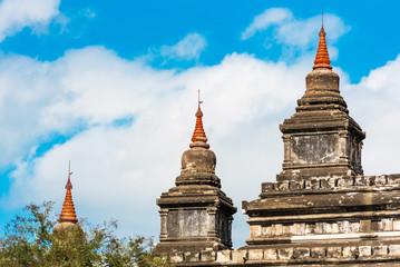 Naklejka premium Pagodas in the temple Thatbyinnyu in Bagan, Myanmar. Copy space for text.