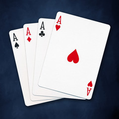 A winning poker hand of four aces playing cards