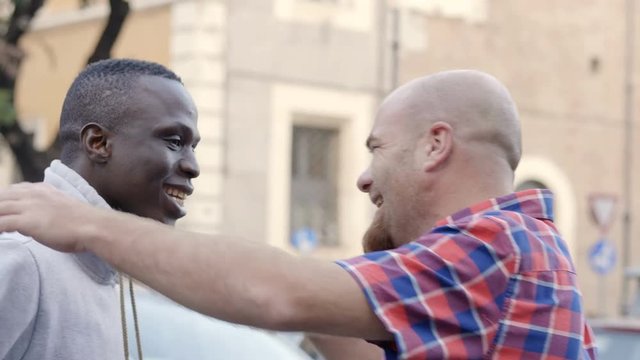 happy greeting between black friend and white friend. Equality, friendship