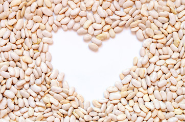 bean seed background with heart and free space for text, top view.