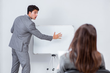 Business presentation in the office with man and woman