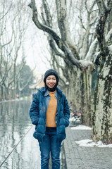 female tourist standing in Xiangyang park on middle Huaihai road, Shanghai