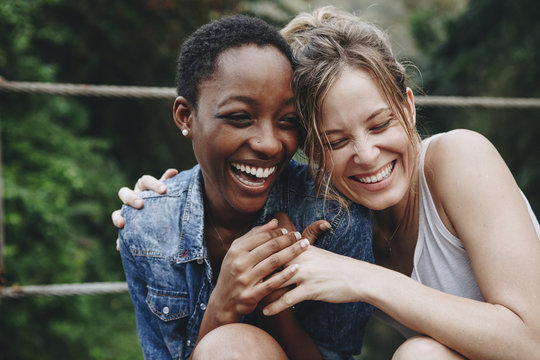 Happy Friends Holding Each Other