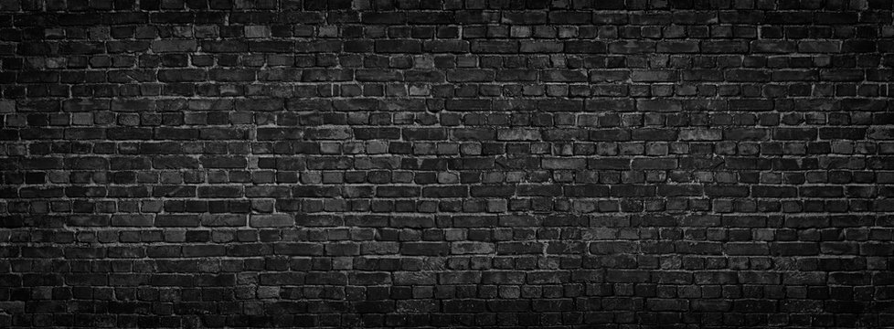 panorama of black brick wall for site caps as background
