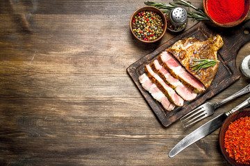 Beef grill with spices on a cutting Board.