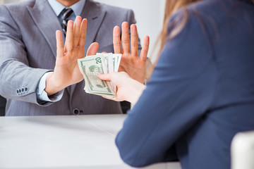 Businessmanbeing offered bribe for breaking law