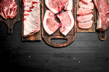 Different types of raw pork meat and beef.