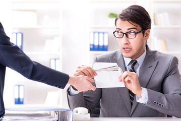 Businessmanbeing offered bribe for breaking law
