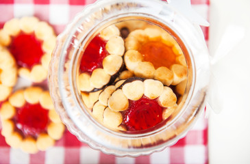 Cookies with jam in a glass jar 
