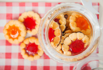 Cookies with jam in a glass jar 