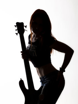silhouette of rock woman playing on electric guitar on a white background.