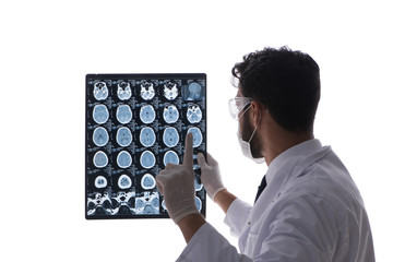 Young doctor looking at x-ray images isolated on white