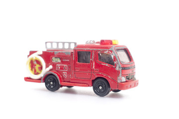 Old red fire truck on a white background.