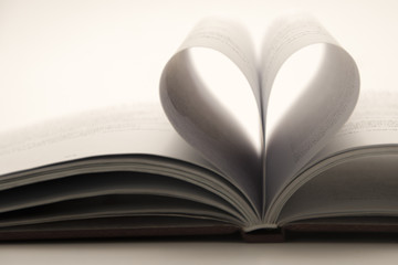 Close up heart shape from paper book . vintage style.