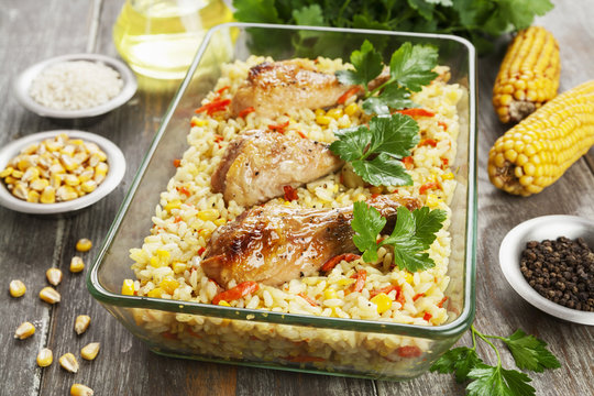 Chicken legs baked with rice and vegetables