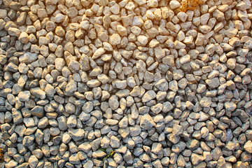 ground stones pattern with warm sun light and shadow for background