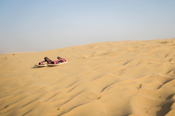 Fototapeta na wymiar A pair of sandals in the desert